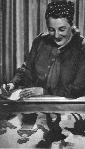 Lotte Reiniger working at a desk